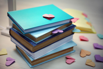 Heart bookmarks for books on wooden table closeup