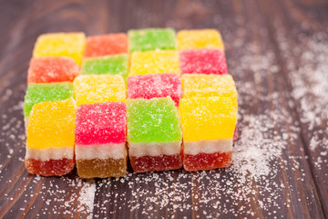 Jelly sweet, flavor fruit, candy dessert colorful on wood background