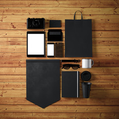 Set of blank generic design office objects on the wood background. Square, top view. 3d render