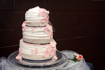pink and white wedding cake  with burlap
