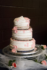 pink and white wedding cake  with burlap