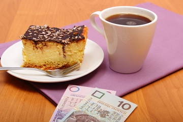 Paying for cheesecake and coffee in the cafe, finance concept
