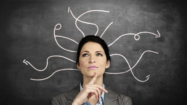 Thoughtful businesswoman looking up