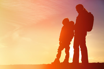 mother and son travel at sunset