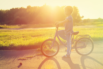 little boy riding bike at sunset, kids sport