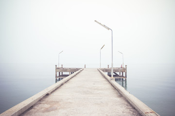Vintage image of pier concrete bridge to the sea