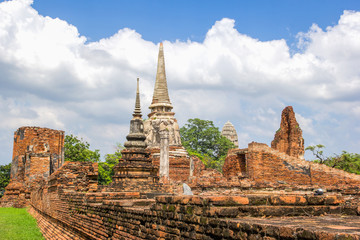 Fototapeta premium Tourist travel to visit ancient pagoda at Wat Mahathat temple, Ayutthaya, Thailand