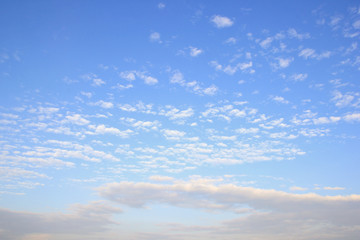 Naklejka na ściany i meble Fantastic soft white clouds against blue sky
