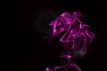 Fototapeta premium Purple smoke on black background