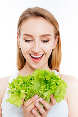 Cheerful woman holding salad