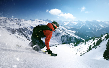 Fototapeta na wymiar Skier goes downhill