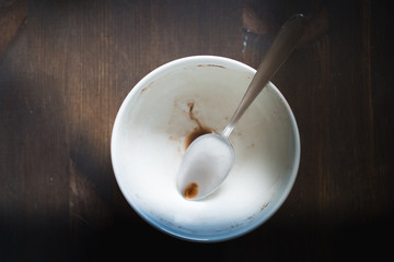 remains of breakfast on the table, filtered intentionally with vintage colors