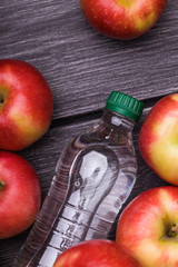 One bottle and apples