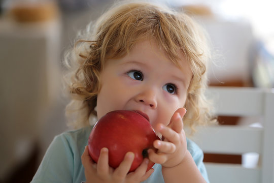 Portrait of kid eating apple