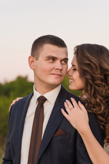 Young wedding couple in the field. Noise and toned image