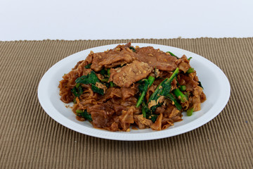 Stir fried flat noodle and pork with dark soy sauce (Thai people called Pad See Ew)