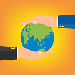 Businessman hands holding globe earth on orange background.