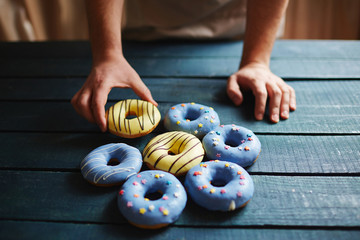 Putting donuts on table