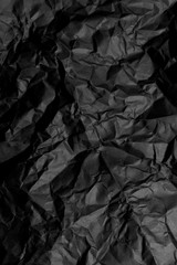 Crumpled black paper
