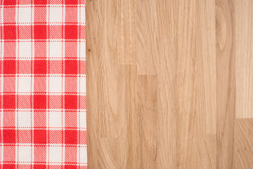 the checkered tablecloth on wooden table