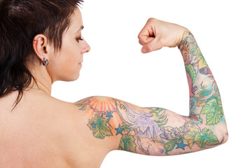 Woman with a tattoo showing biceps