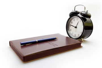 Notebook, pen and clock in retro style