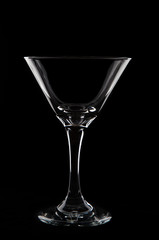 Empty  martini  glass on black background studio shot