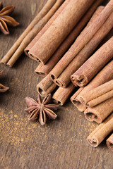 cinnamon sticks and  star anise on wooden background