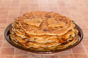 Homemade waffles with fried onions, champignons and cheese on plate. Romantic breakfast
