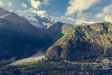 Mountains rising above valley. 
