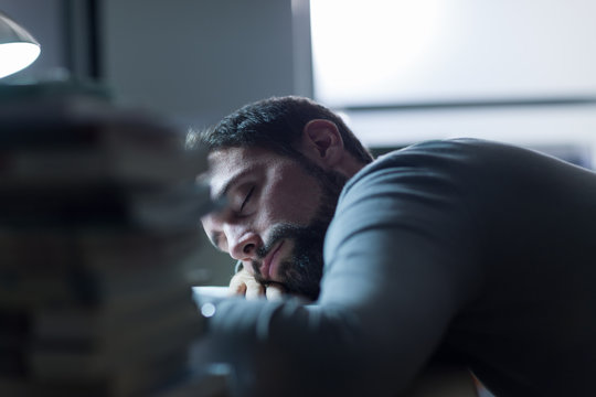 Man Sleeping At His Desk