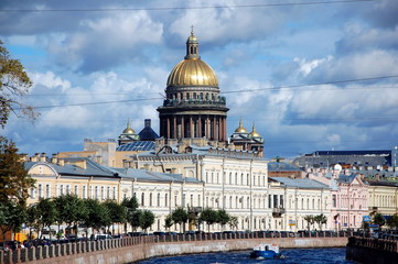 Fototapeta na wymiar View of the embankment of the Moika River and St. Isaac's Cathedral, St. Petersburg, Russia 