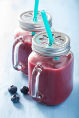 healthy strawberry blueberry smoothie in mason jars