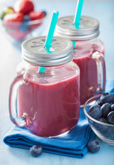 healthy strawberry blueberry smoothie in mason jars