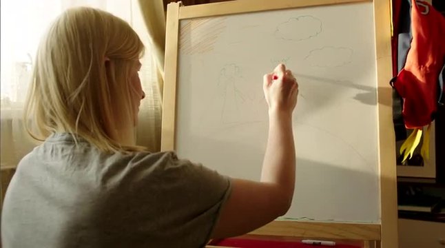 Woman Drawing Happy Family on Marker Board