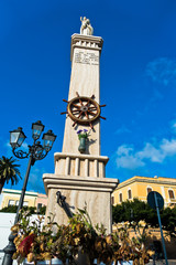 Fototapeta premium Monument at Carloforte harbor, San Pietro island, Sardinia, Italy