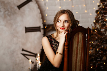 Portrait of a beautiful long-haired young girl in black Evening