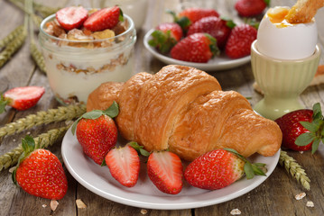 Fresh croissant with strawberries