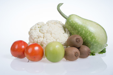 cauliflower,kiwi,tomatoes,jujubes and bottle gourd isolated on white background