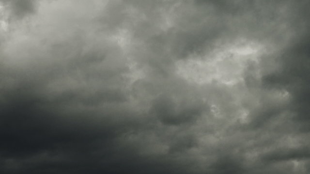 Dark stormy raining clouds time lapse footage, weather forecast, climate change or passing of time background footage.