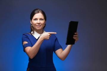 Girl in a blue suit. Keep a folder in his hands. Blue background