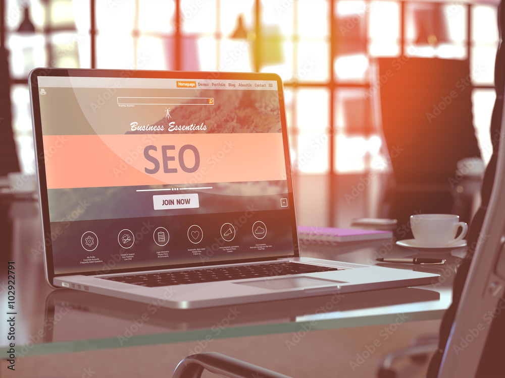 Poster modern workplace with laptop showing landing page with seo - search engine optimization - concept. t