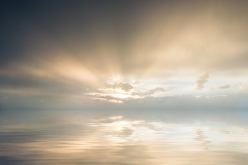 Majestic sunset over sea, cloud reflection in water