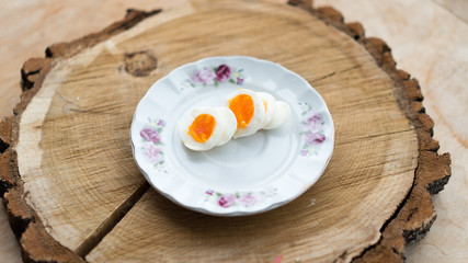 Sliced boiled egg. Breakfast healthy food on porcelain plate.