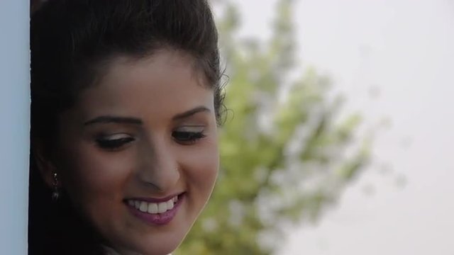 Locked-on shot of a beautiful woman smiling, Sohna, Gurgaon, Haryana, India