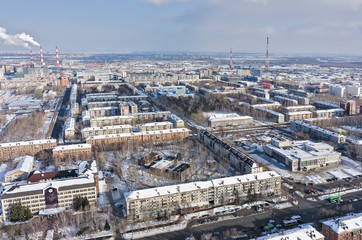 Tyumen, Russia - February 14, 2016: Aerial view onto residential area, entertaining institution of builders and TV towers on background
