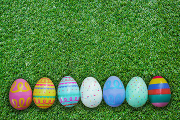 Easter egg on green grass texture and background