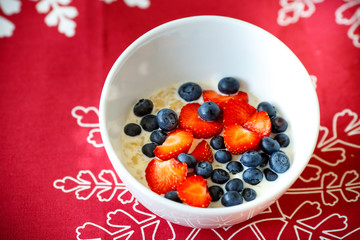 Hot oatmeal breakfast with fresh fruits