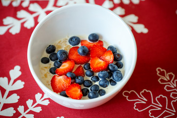 Hot oatmeal breakfast with fresh fruits