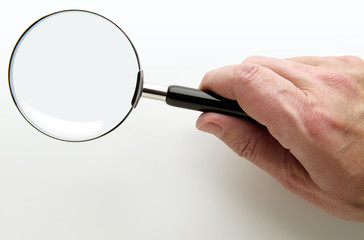 Hand with Magnifying glass